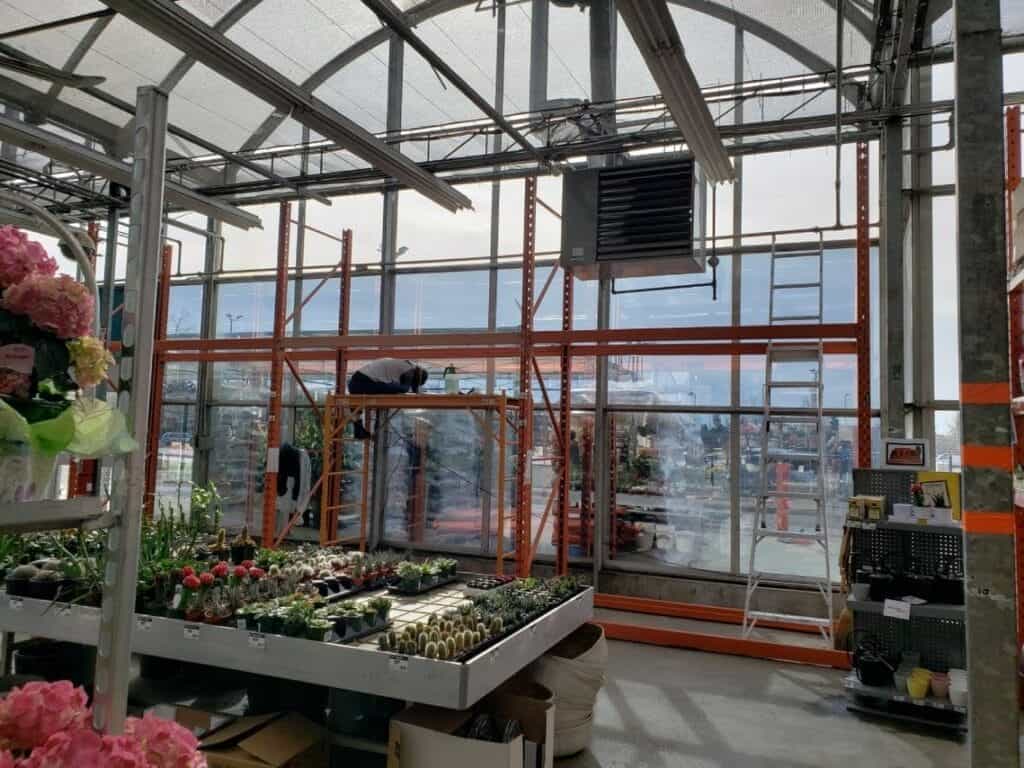 Performance Signs professional window film installation in greenhouse, Edmonton AB